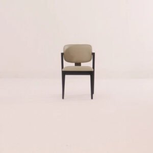 Balthazar Dining Chair handcrafted from solid wood with an upholstered backrest, cushioned fabric seat, and elegant walnut finish.