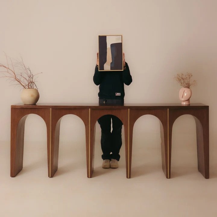 Modern solid Acacia wood console table with arched legs, brass inlay accents, walnut finish, size 210 × 40 × 90 cm.