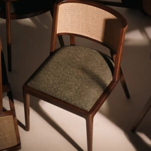 Cairo Dining Chair crafted from solid wood with a curved upholstered backrest, premium fabric seat, and walnut finish.