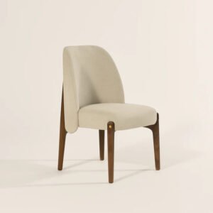 Potter Dining Chair handcrafted from solid wood with a curved upholstered backrest, cushioned fabric seat, and walnut finish.