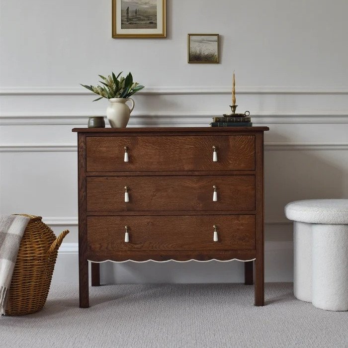 Elegant wooden 3-drawer chest with decorative handles and scalloped edge